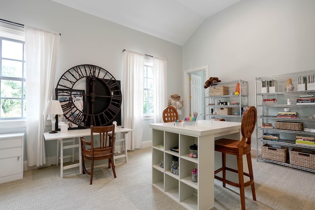 office area with lofted ceiling and light colored carpet