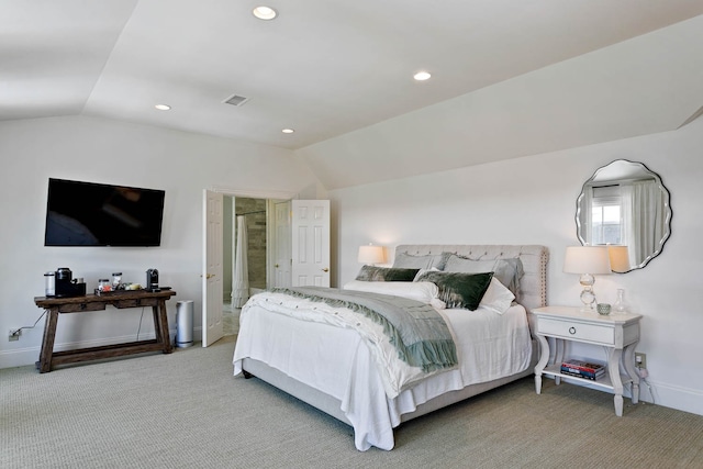 bedroom featuring lofted ceiling and light carpet