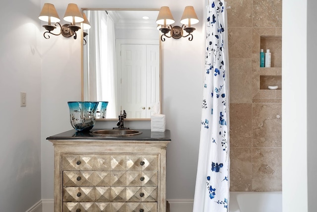 bathroom featuring ornamental molding, shower / tub combo, and vanity