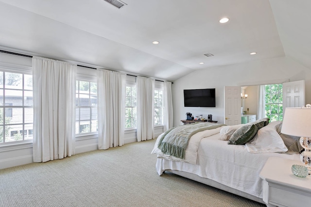 carpeted bedroom featuring vaulted ceiling