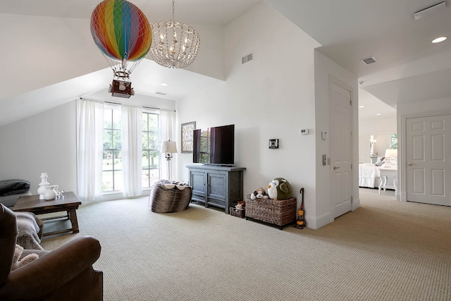 sitting room featuring lofted ceiling, a notable chandelier, and light carpet