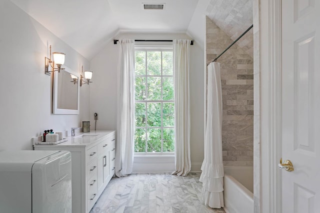 bathroom with lofted ceiling, shower / tub combo with curtain, and vanity