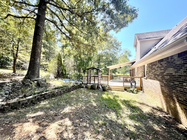 view of yard featuring a deck