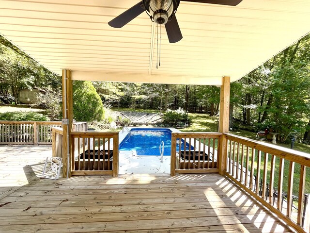 wooden deck featuring ceiling fan