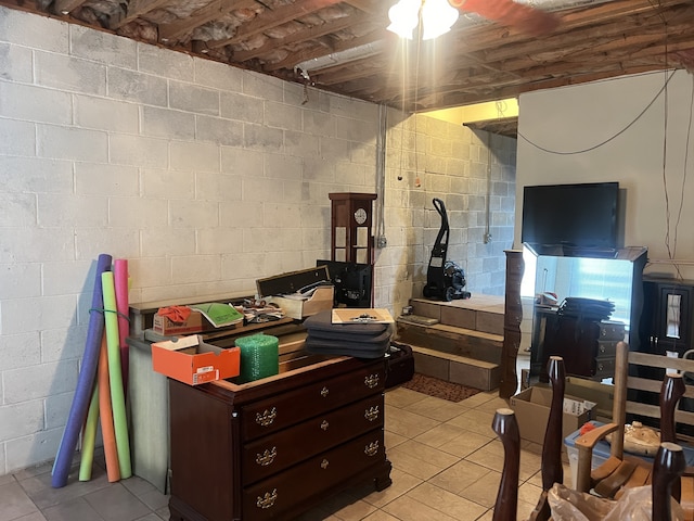 basement with light tile patterned flooring