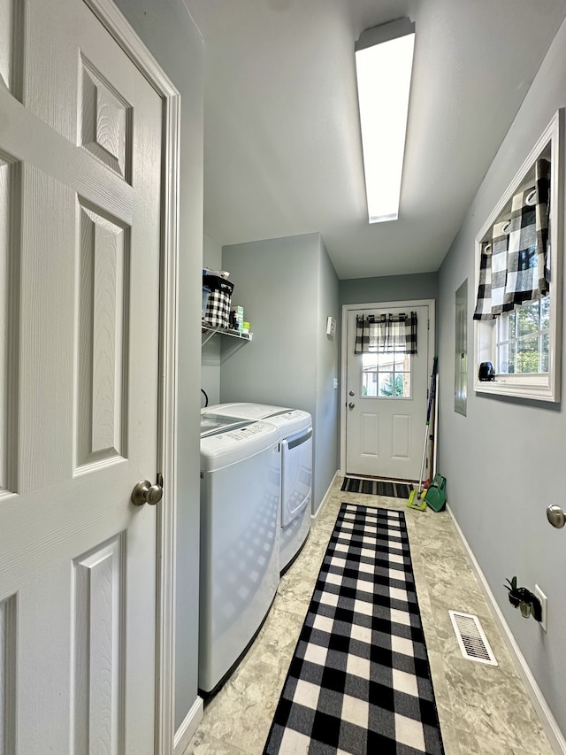 laundry room featuring washing machine and dryer