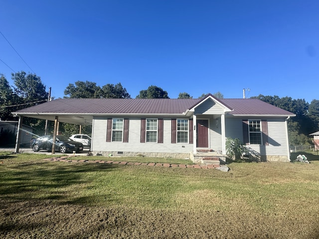 view of front of home with a carport and a front lawn