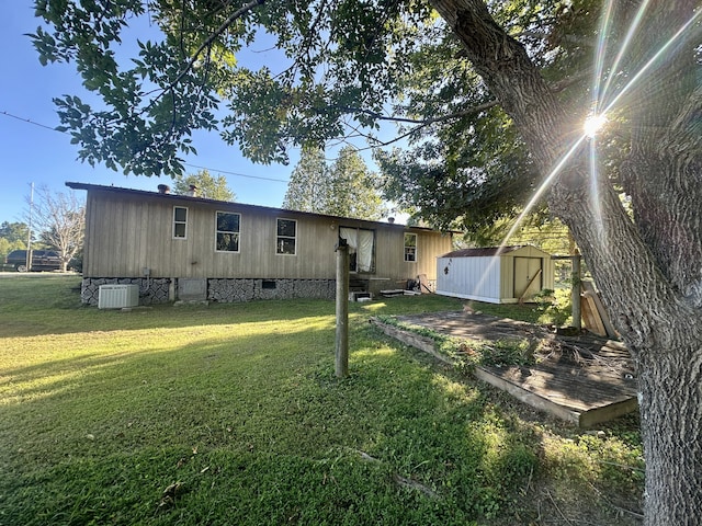 exterior space with a storage shed and a lawn