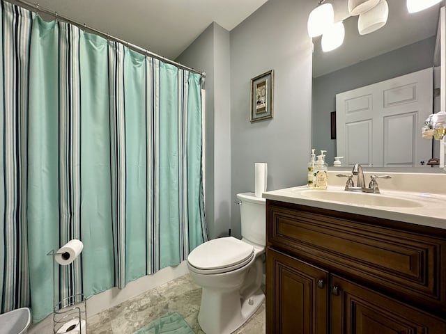 bathroom featuring vanity, toilet, and a shower with shower curtain