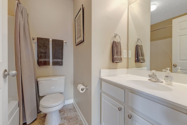 full bathroom with vanity, shower / tub combo with curtain, a textured ceiling, and toilet