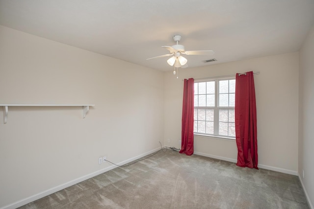 carpeted empty room with ceiling fan