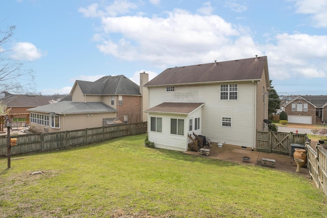 back of property featuring a yard and a patio area