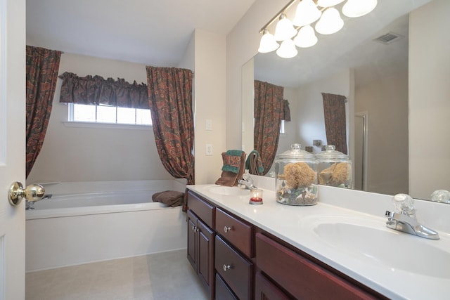 bathroom with vanity and shower with separate bathtub