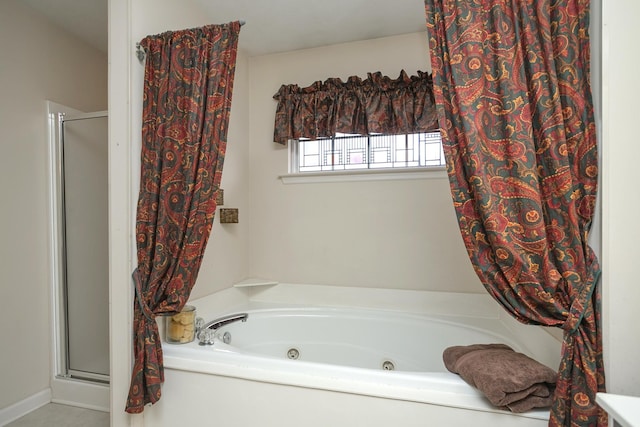 bathroom featuring separate shower and tub