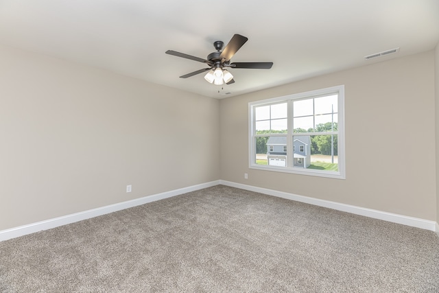 carpeted empty room with ceiling fan