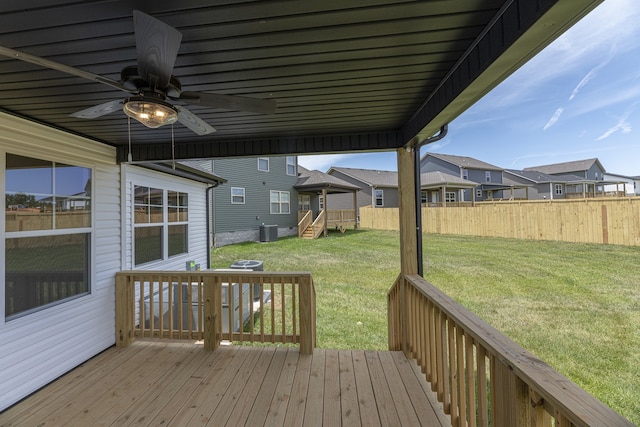 deck featuring central AC unit, a yard, and ceiling fan