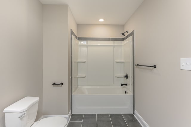 bathroom with shower / bathtub combination, toilet, and tile patterned floors