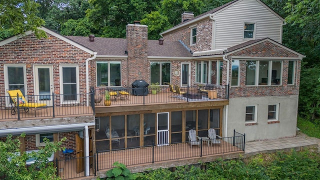 5053 Villa Crest Dr, Nashville, TN 37220 - rear view of property featuring a chimney, a sunroom, brick siding, and a shingled roof