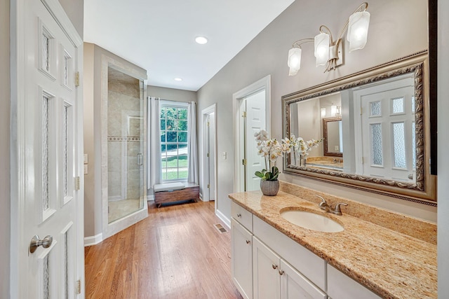 5053 Villa Crest Dr, Nashville, TN 37220 - full bathroom featuring a stall shower, vanity, wood finished floors, and recessed lighting