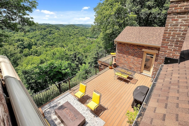 5053 Villa Crest Dr, Nashville, TN 37220 - wooden deck featuring a fire pit and a wooded view