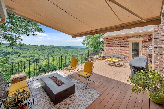 5053 Villa Crest Dr, Nashville, TN 37220 - wooden terrace with an outdoor fire pit, a forest view, and area for grilling