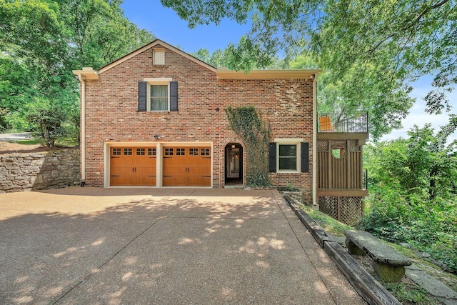 5053 Villa Crest Dr, Nashville, TN 37220 - view of front of property featuring concrete driveway, brick siding, and a garage