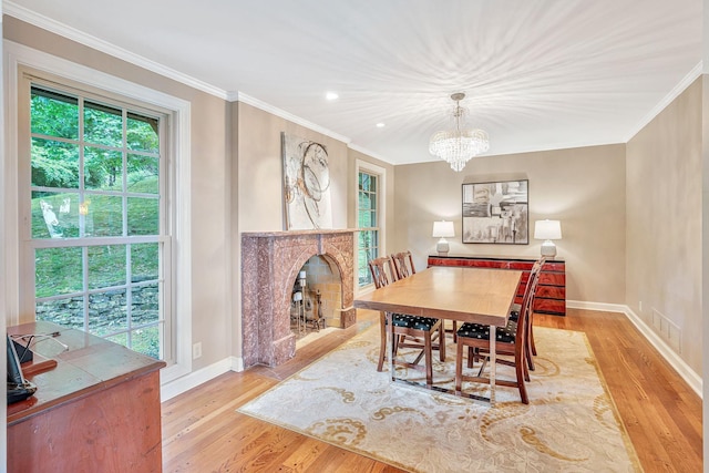 5053 Villa Crest Dr, Nashville, TN 37220 - dining space with healthy amount of natural light, crown molding, light wood-style floors, a fireplace, and recessed lighting