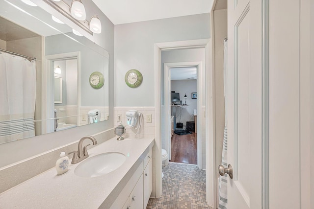 5053 Villa Crest Dr, Nashville, TN 37220 - full bathroom featuring vanity, tile patterned floors, a wainscoted wall, and tile walls