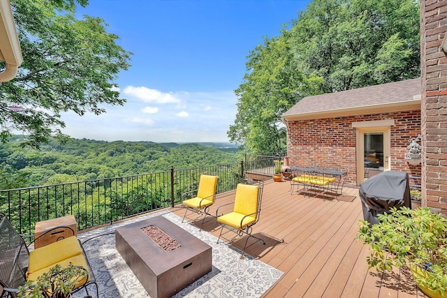 5053 Villa Crest Dr, Nashville, TN 37220 - wooden deck with an outdoor fire pit, a view of trees, and a grill