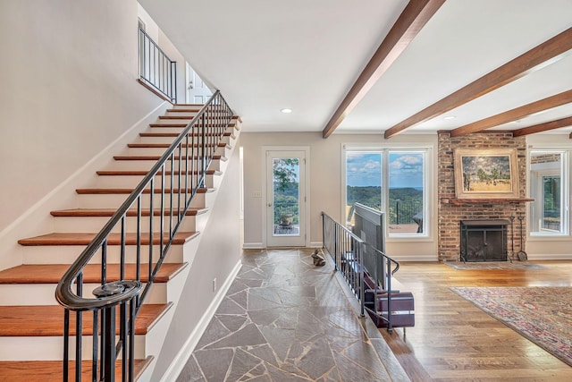 5053 Villa Crest Dr, Nashville, TN 37220 - stairs featuring beamed ceiling, recessed lighting, a brick fireplace, and stone finish flooring