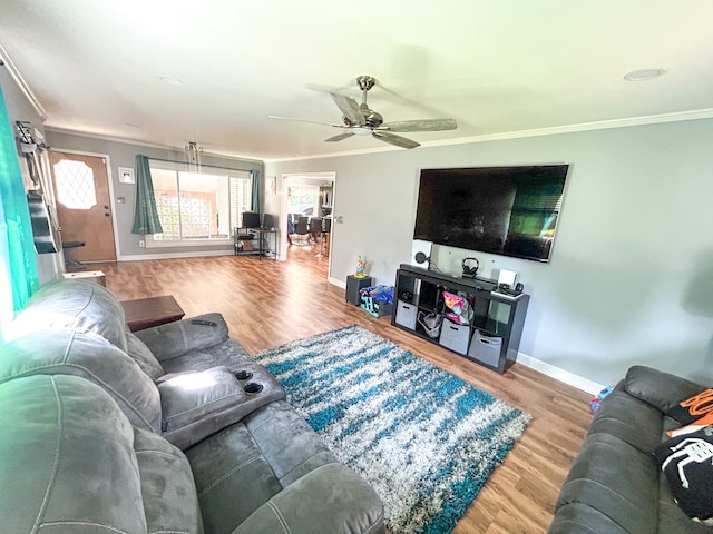 living room with ceiling fan, ornamental molding, and hardwood / wood-style floors