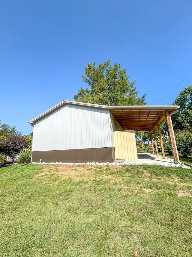 view of outbuilding with a yard