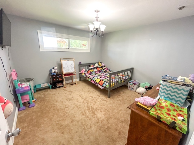 carpeted bedroom with a chandelier