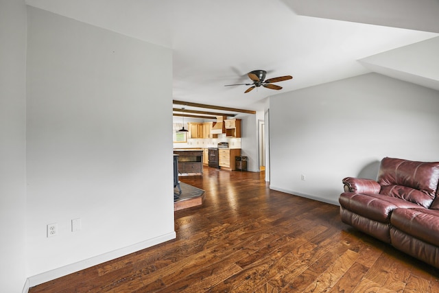 living room with ceiling fan, vaulted ceiling, and dark hardwood / wood-style flooring