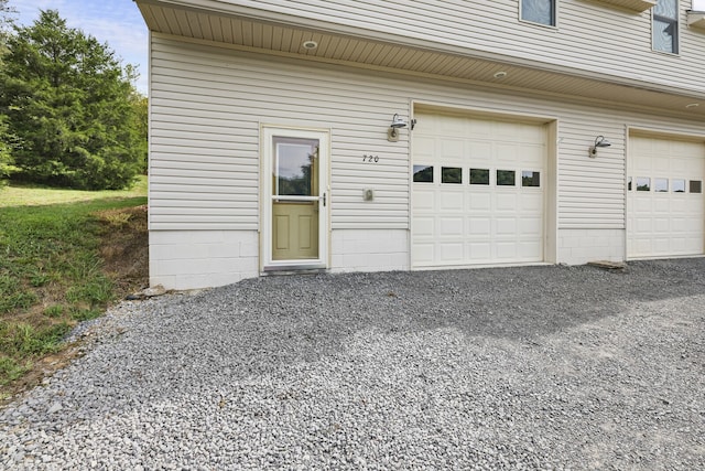 garage featuring wood walls