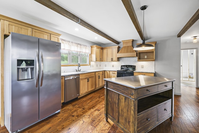 kitchen featuring appliances with stainless steel finishes, dark hardwood / wood-style flooring, custom range hood, and sink