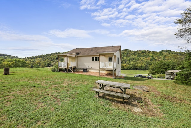 back of house featuring a yard