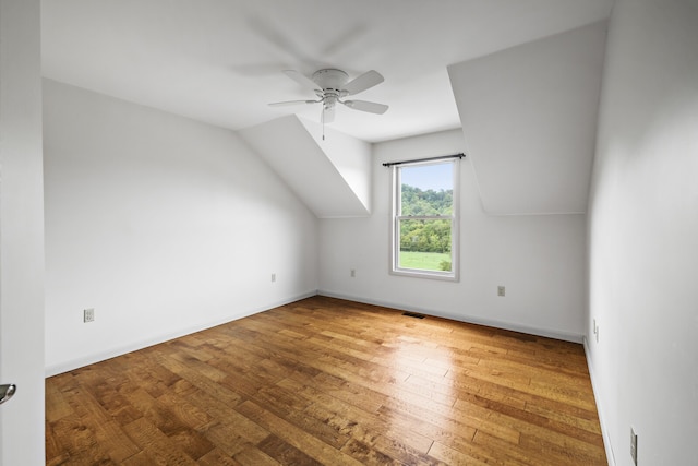 bonus room with lofted ceiling, wood-type flooring, and ceiling fan