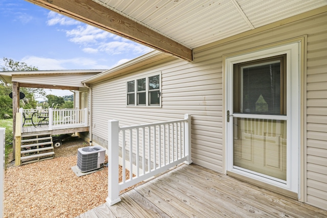 wooden deck with central air condition unit