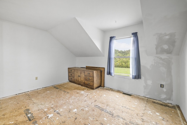 additional living space featuring vaulted ceiling