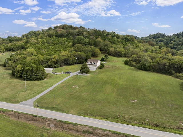 birds eye view of property with a rural view