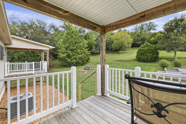 wooden terrace with central AC and a yard