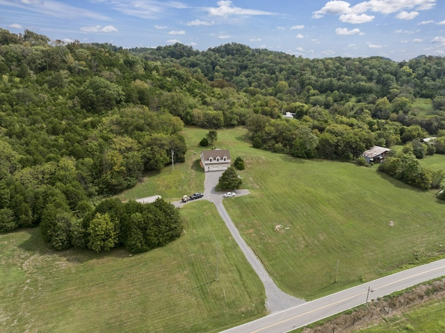 birds eye view of property with a rural view