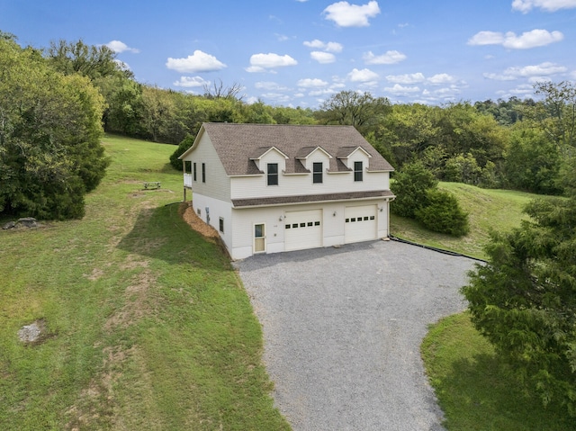 view of front of property with a garage and a front yard