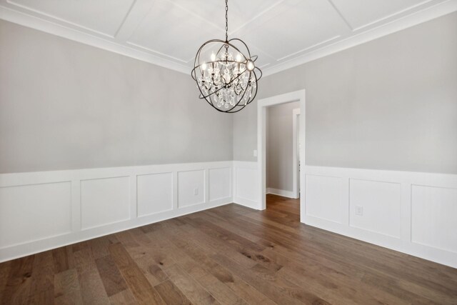 unfurnished dining area featuring dark wood-type flooring and a chandelier