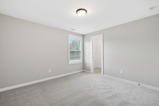 spare room featuring carpet floors