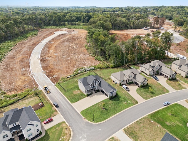 aerial view with a forest view and a residential view