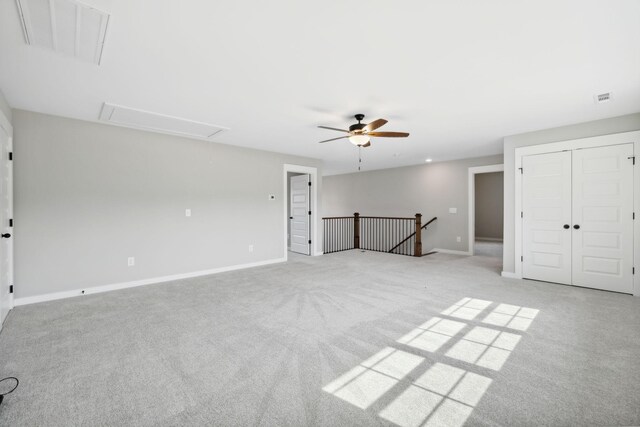 unfurnished bedroom featuring ceiling fan and light carpet