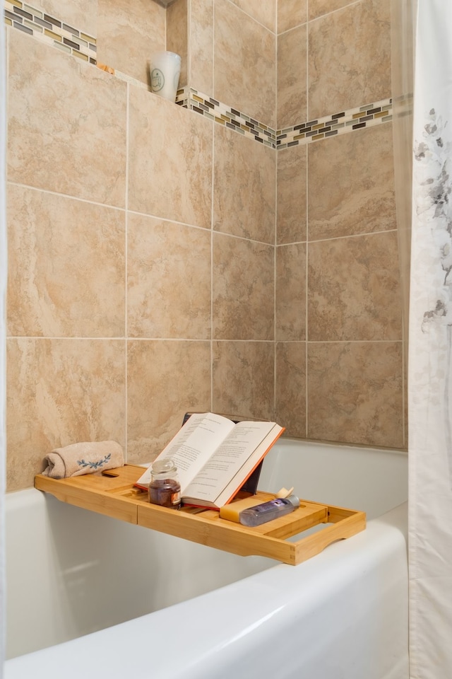 bathroom with shower / bathtub combination with curtain