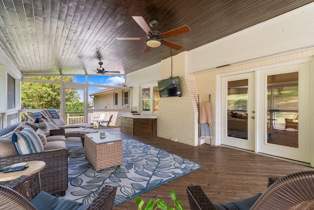 view of patio featuring an outdoor living space, a deck, and ceiling fan